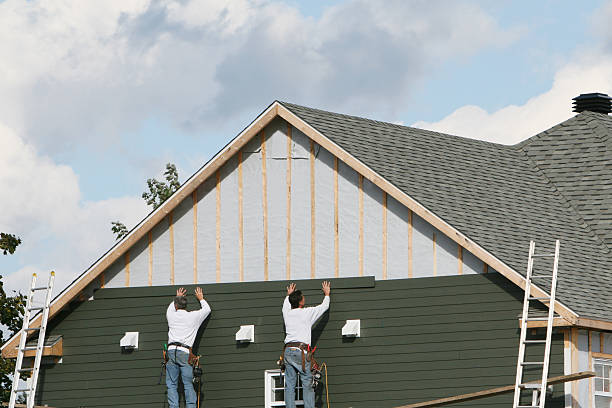 Professional Siding Repair technician working in Rayland, OH